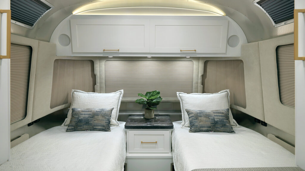 Double beds inside an Airstream Classic.