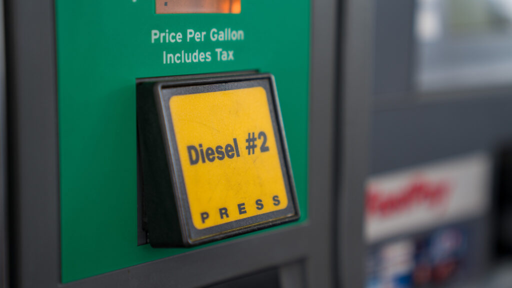 Close up of a diesel pump at a gas station.