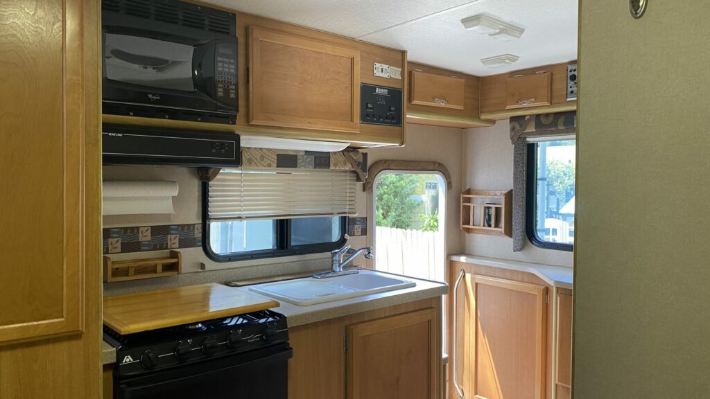 A truck camper kitchen before being renovated.