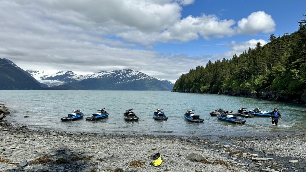 A group of tourists about to go on a Glacier JetSky Adventures Tour in Alaska.