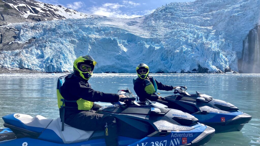 A couple on a JetSki during a Glacier JetSki Adventure Tour.