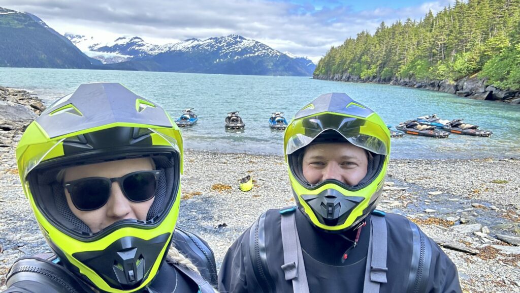 A couple taking a selfie on a JetSki during a Glacier JetSki Adventure Tour.