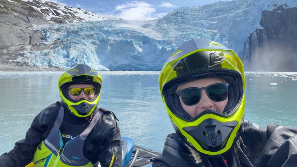 A couple taking a selfie on a JetSki during a Glacier JetSki Adventure Tour.