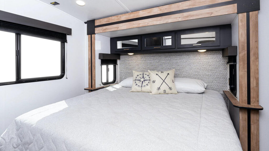 A bedroom inside a Keystone Outback trailer.