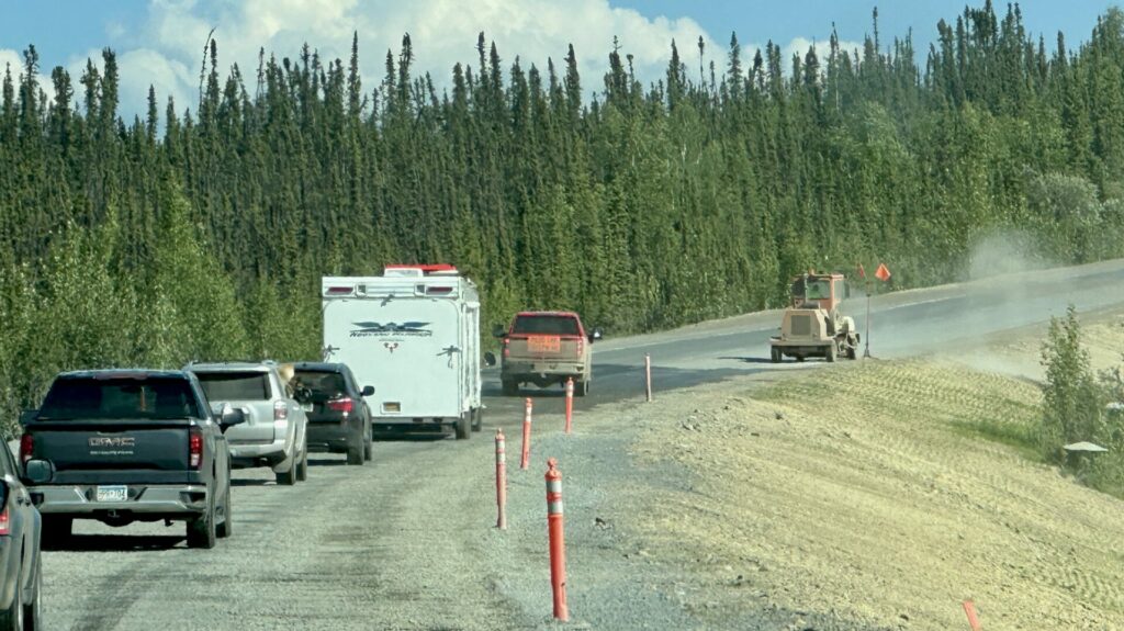 Cars backed up on the Alaska Highway at the Destruction Bay section.