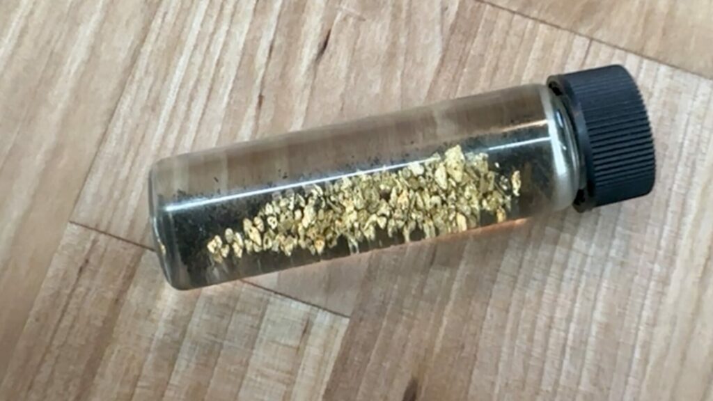 Close up of gold in a vial found during a Prospector John's Tour.