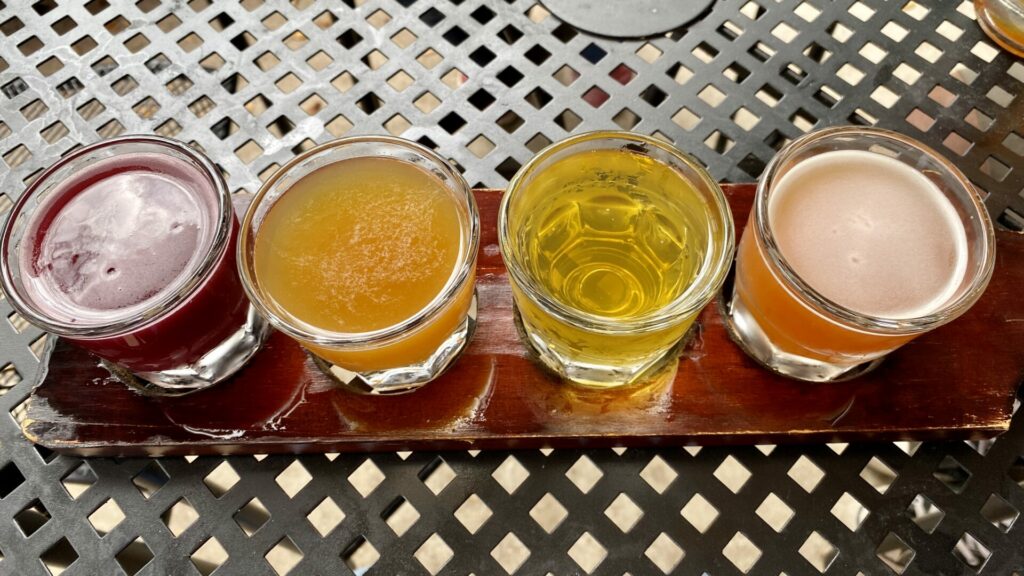 A beer flight with four different colorful beers at a brewery in Cooper Landing, Alaska 