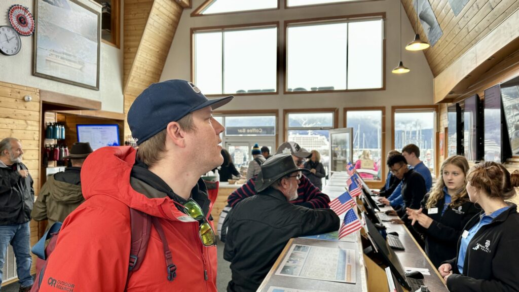 People signing in at at Kenai Fjords Tours.