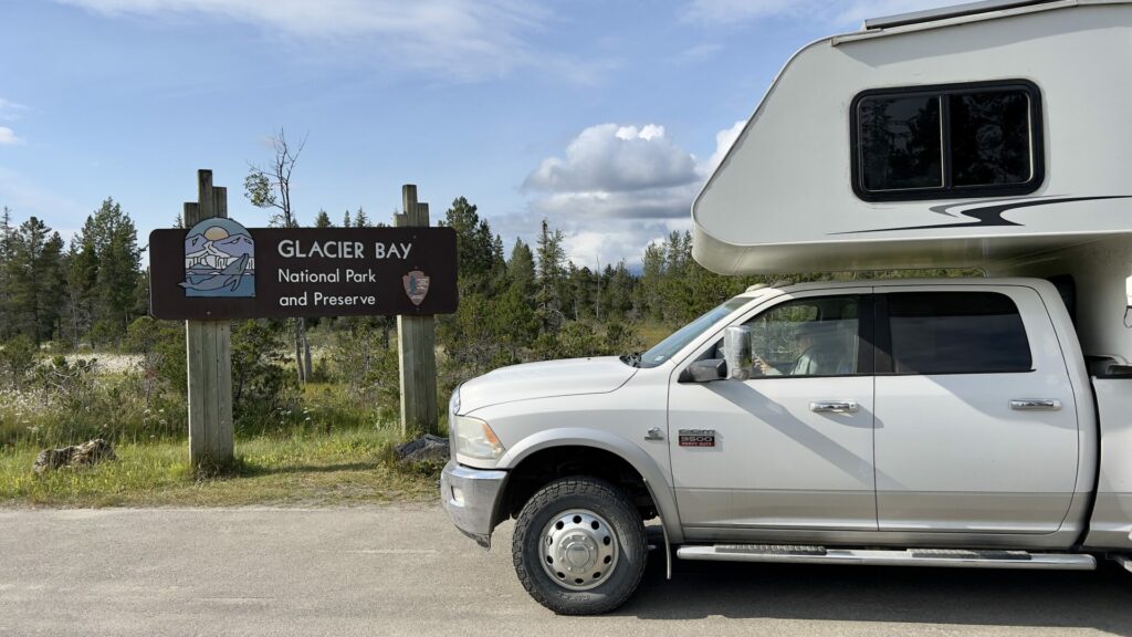 A truck camper entering Glacier Bay National Park.