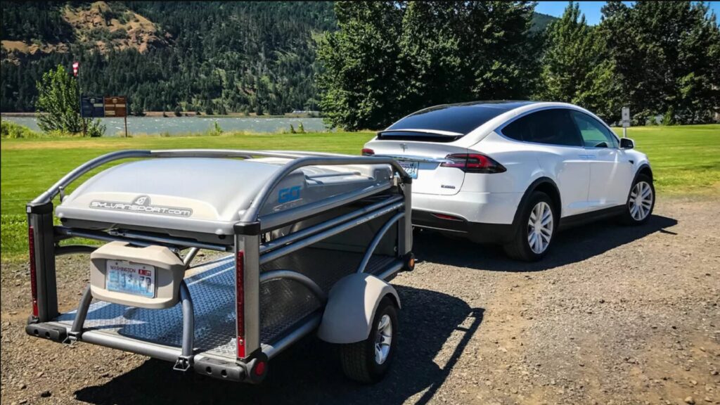 Sylvan Sport Go pop up camper towed behind Tesla