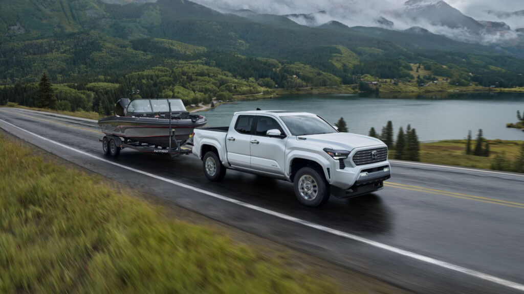 An Toyota Tacoma towing a boat.