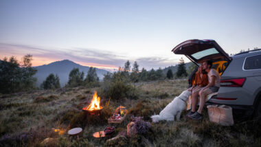 A couple spending time together on a camping trip.