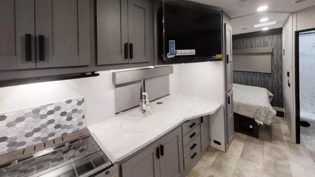 Overview of a kitchen area inside a Forest River Solar 27DSE motorhome.
