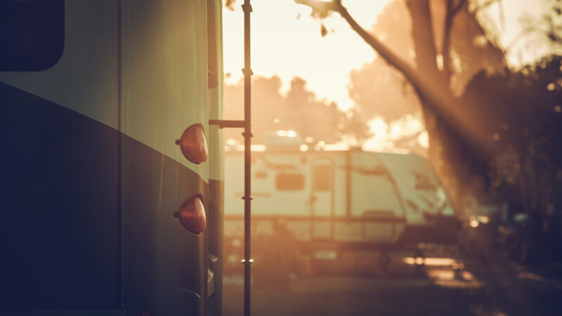 Close up of a motorhome for a family of four parked at an RV park.
