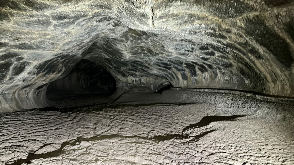 The Valentine Cave lit up showing the smooth walls and floor. 