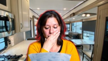 A woman shocked reading her high RV electric bill.