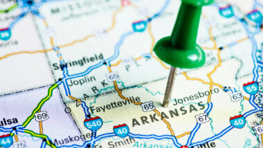 A push pin on Arkansas on a map.
