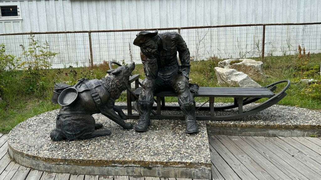 Statue of a sad miner outside the Klondike Gold Rush National Park visitors center