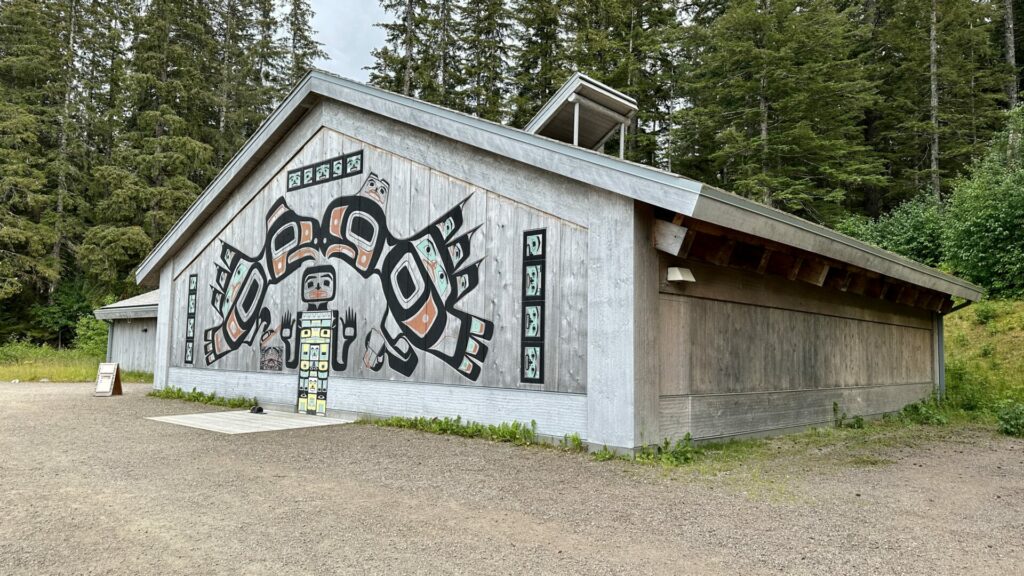 The Xunaa Shuká Hít in Gustavus, AK showing the native american paintings on the exterior. 