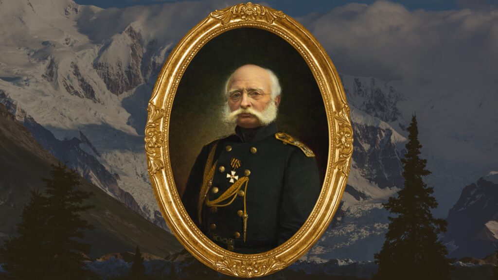A historic photo of Ferdinand von Wrangel in a gold frame and the Wrangell Mountains in the background. 