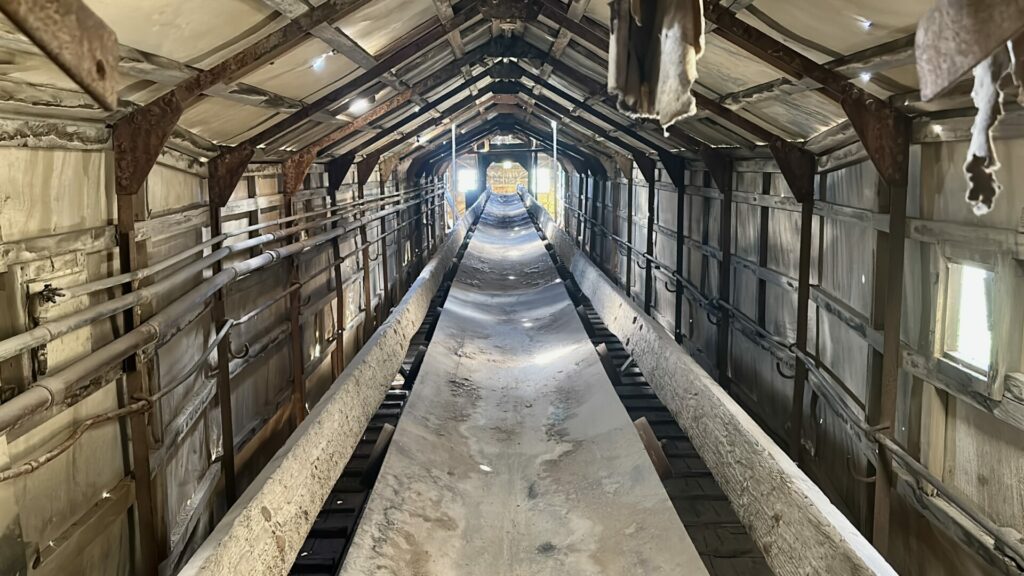 An interior shot of Dredge 8 showing the conveyor belt that would dump tailings of dirt that already had the gold extracted from it.
