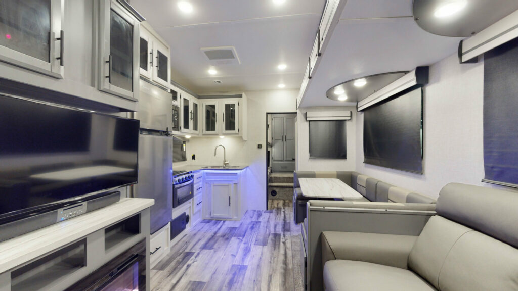 Interior shot of the Volante VL295BH showing the kitchen, dinette, and some of the living space. This is one of the best fifth wheels for a family of 5.