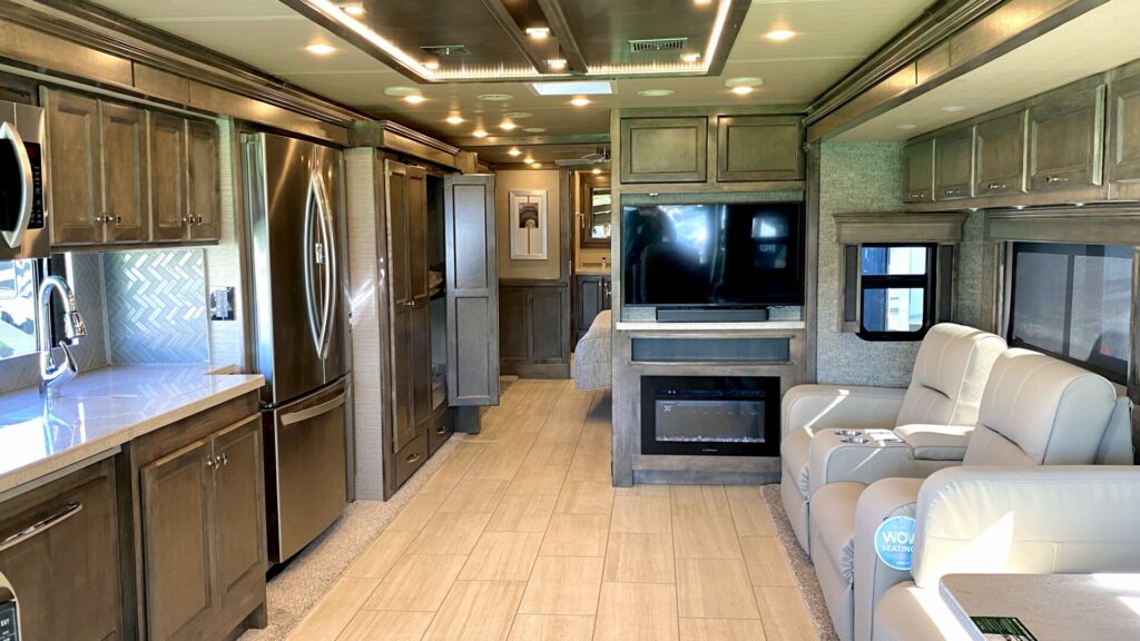 Interior shot of a Class A motorhome from the front to back. 