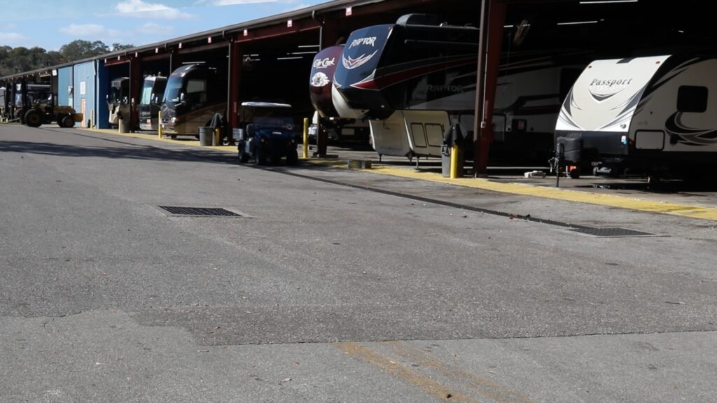 The service bays at the Lazydays RV Tampa location with a few rigs being worked on that are Crown Club members.