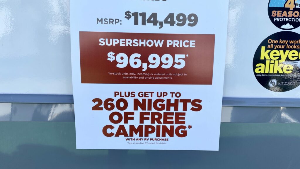 A sticker on a fifth wheel that shows special sale pricing at an RV show. 