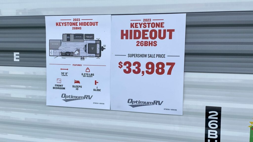 A sticker on a Keystone Hideout travel trailer that shows special sale pricing at an RV show. 