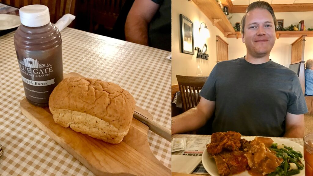 Jason eating at an Amish restaurant with a full plate of food and bread with honey. 