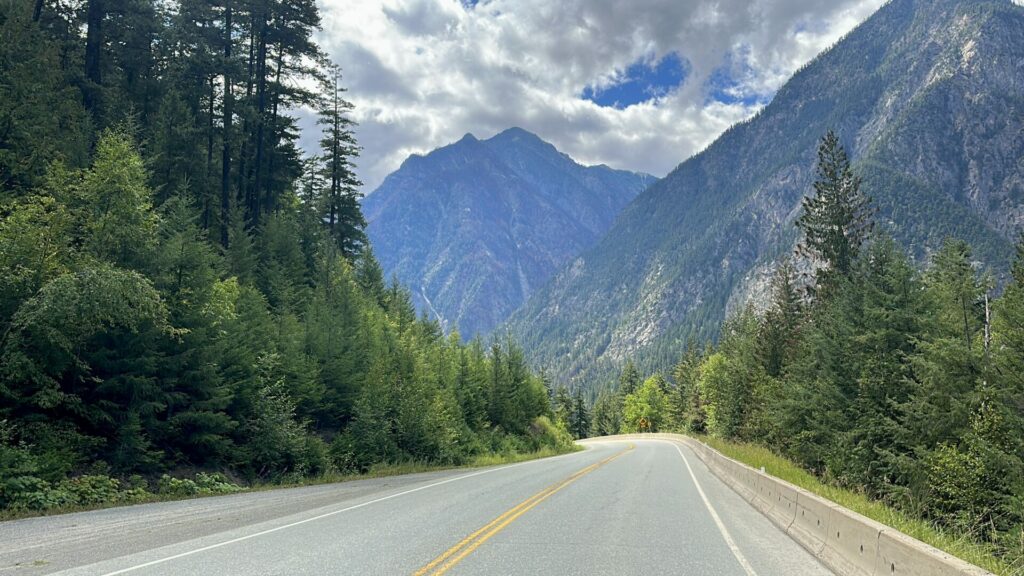 A view of mountain peaks and forest on the sea to sky highway. 