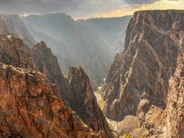 View of Black Canyon of the Gunnison at sunset with golden light