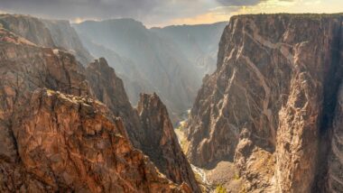 View of Black Canyon of the Gunnison at sunset with golden light