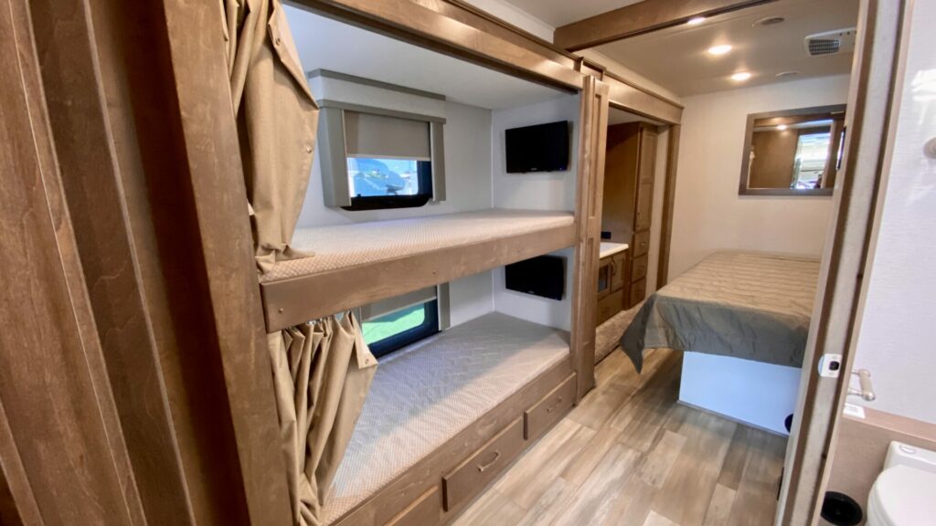 Bunk beds built into a slide out in an RV. They are oddly shaped.