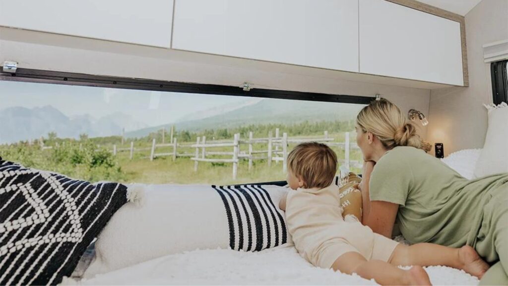 A woman and her child looking out the back window of their inTech Sol Horizon. 