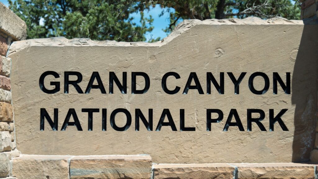 Stone Grand Canyon National Park sign.