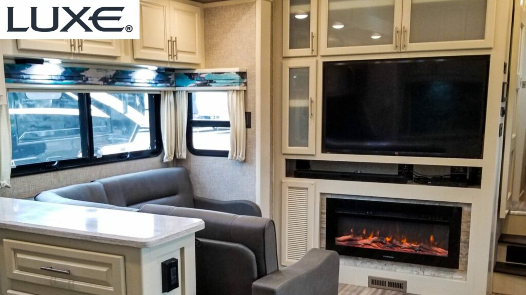 Interior of a Luxe RV showcasing premium woods in the living area with residential finishes. 