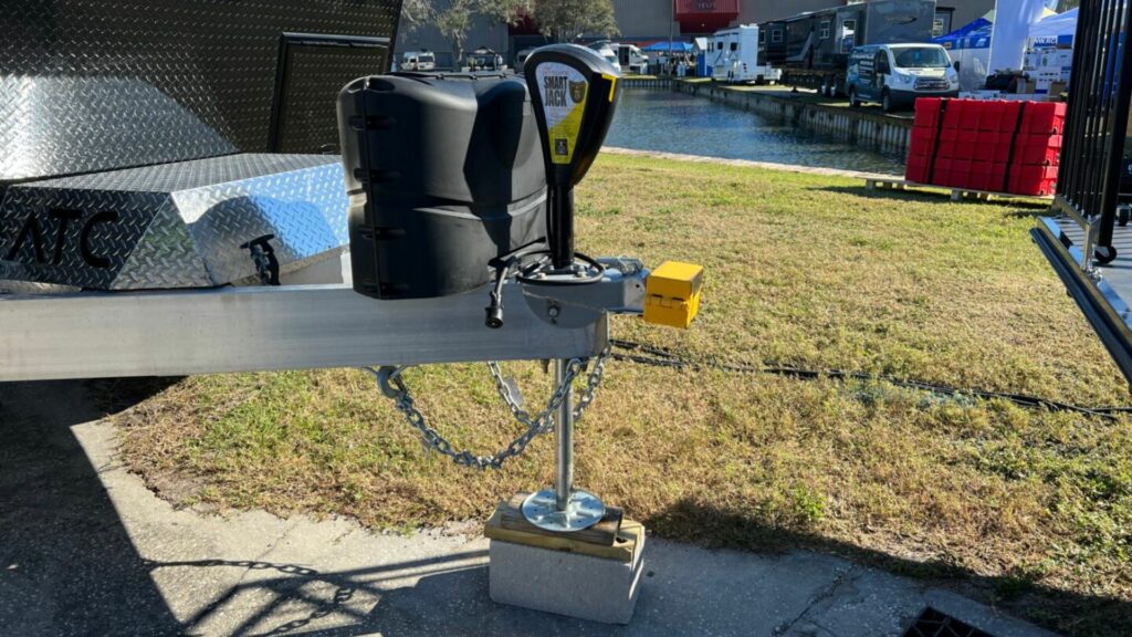 A trailer hitch lock on a travel trailer that is being shown at an RV show.