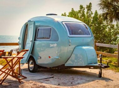 Blue Barefoot retro trailer on the beach.