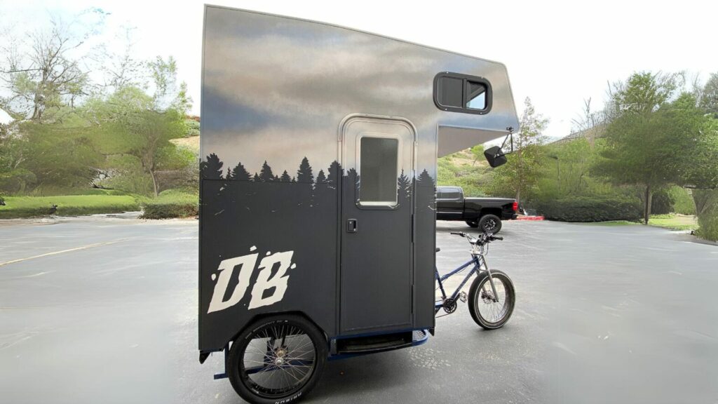 The Dangie Bros Bike Camper 2.0 in a parking lot.