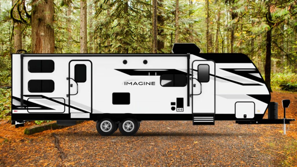 A photo of the Imagine RV travel trailer by Grand Design with a forest background. 