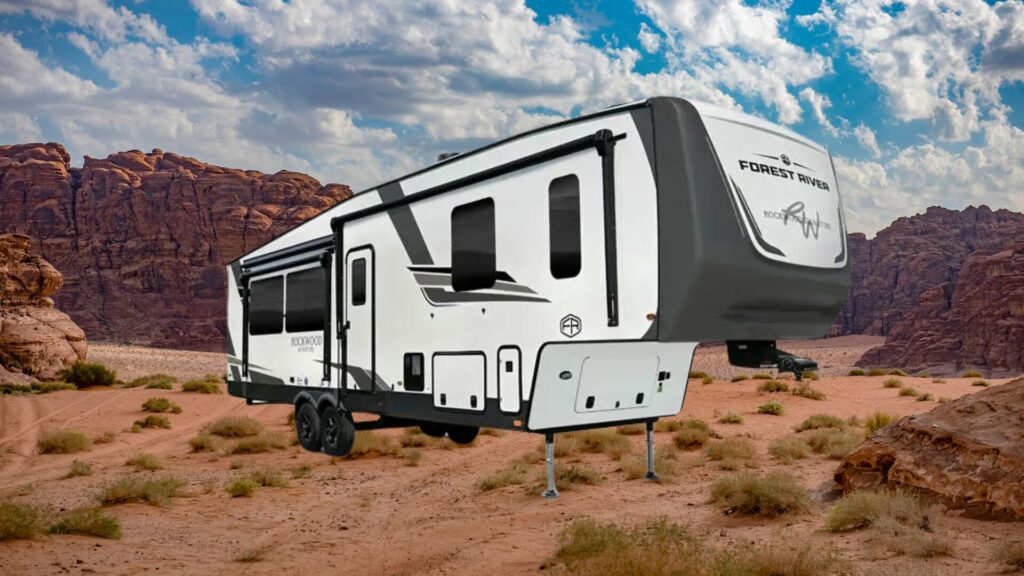 A photo of the ForestRiver Rockwood 2517S RV travel trailer with a red rocky desert background. 