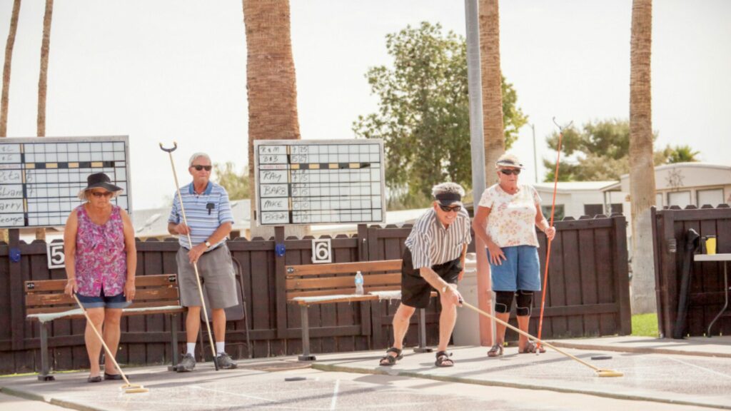 Elderly people playing shuffleboard at Araby Acres RV Resort. 