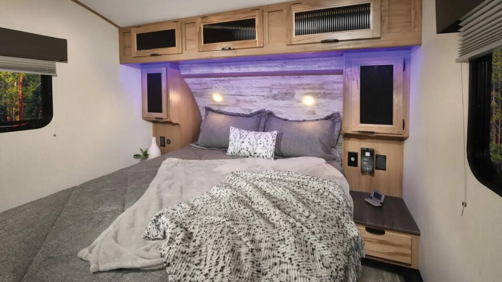 A photo of the ForestRIver Arctic Wolf main bedroom with grey bedding. 