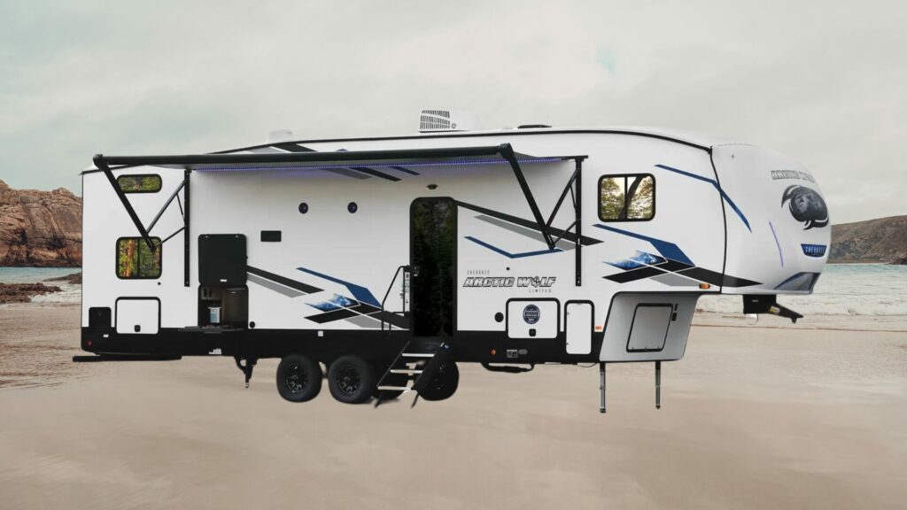 A photo of the Forest River Arctic Wolf 287BH 5th wheel RV Trailer on a beach background.