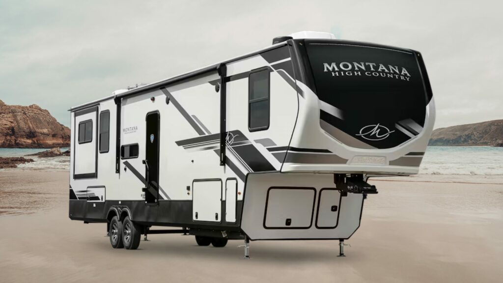 A photo of the Montana High Country 295RL floorplan 5th Wheel RV Trailer on a beach. 