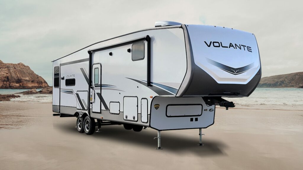 A photo of the Crossroads RV Volante VL295BH 5th wheel RV on a beach. 