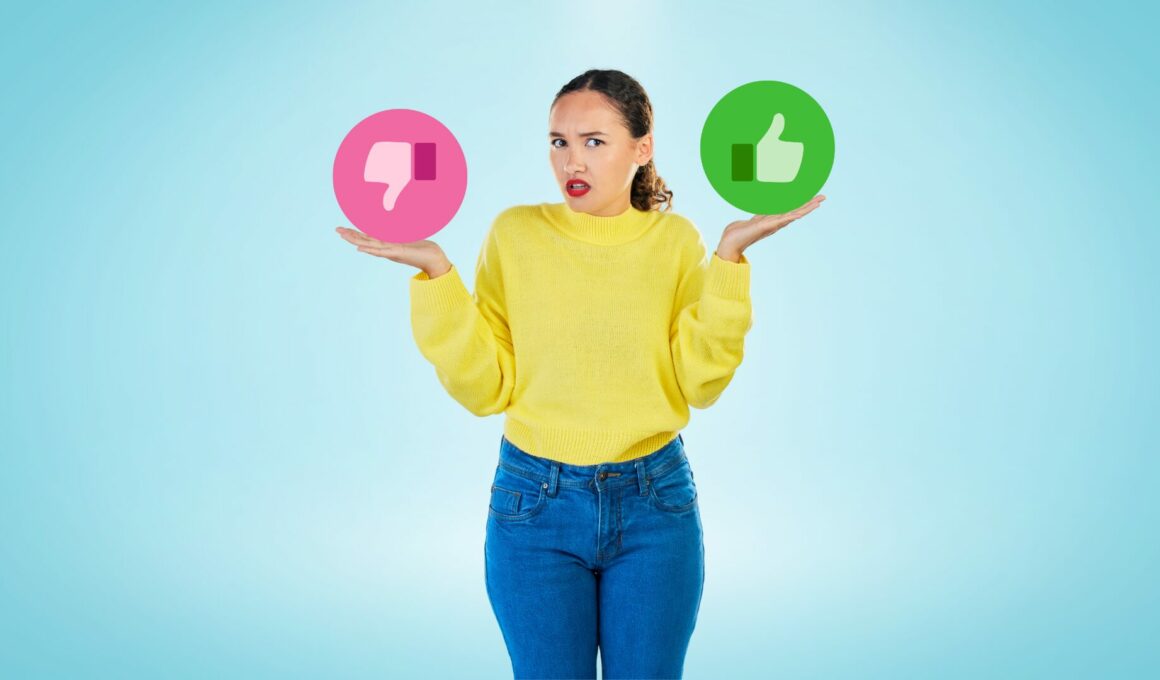 Woman in yellow sweater gesturing "I don't know" with a pink thumbs down in one hand and a green thumbs up in the other.