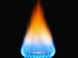 Natural gas aflame with black background.